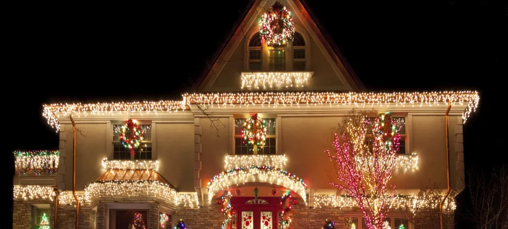 white house with multi colored string lights